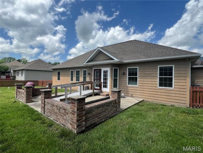 Back of house featuring a patio area and roof with shingles | Image 24