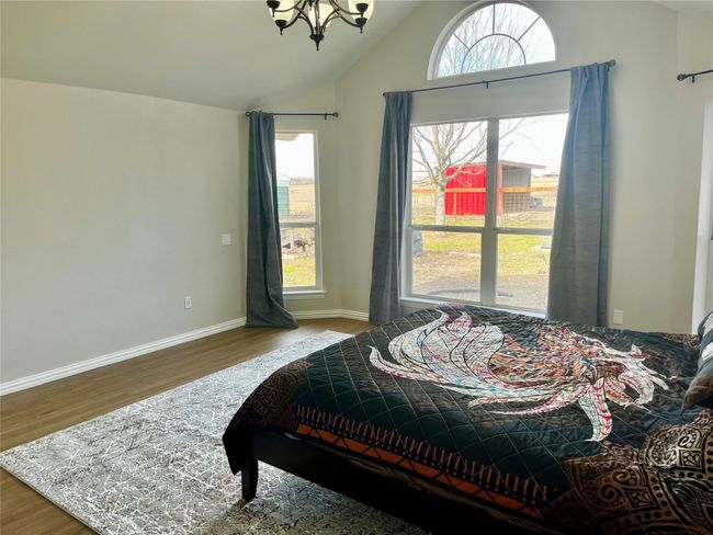 Split primary bedroom with views to backyard | Image 12