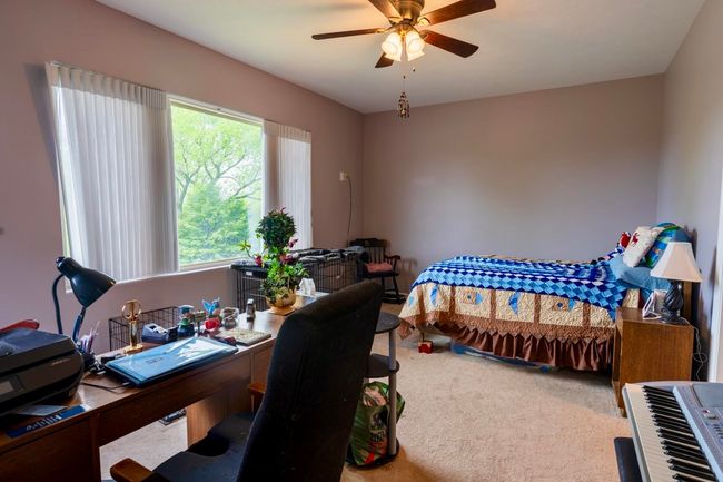 Bedroom featuring carpet floors and a ceiling fan | Image 14