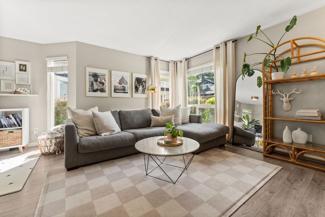 Living room featuring light wood-style flooring | Image 10