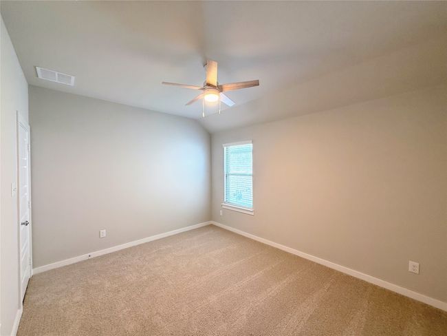 Spare room with a ceiling fan, light colored carpet, and baseboards | Image 24