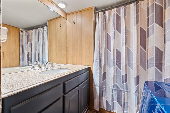 Bathroom featuring vanity and a shower with shower curtain | Image 15