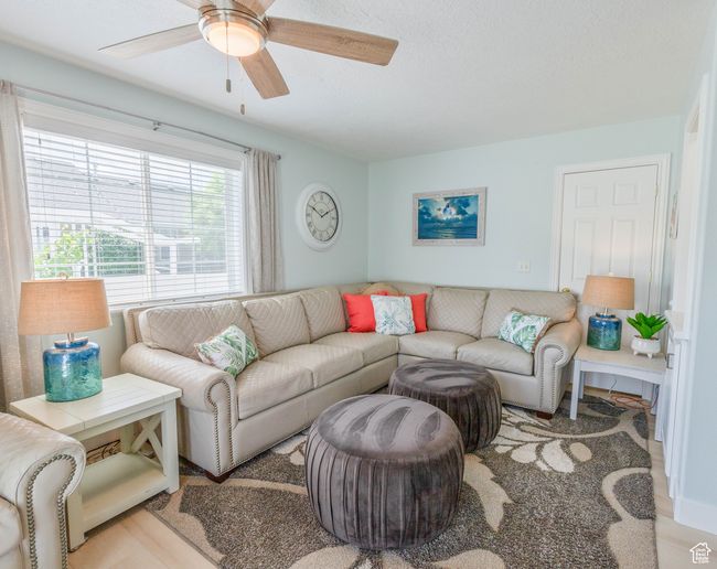 Living area featuring ceiling fan | Image 29