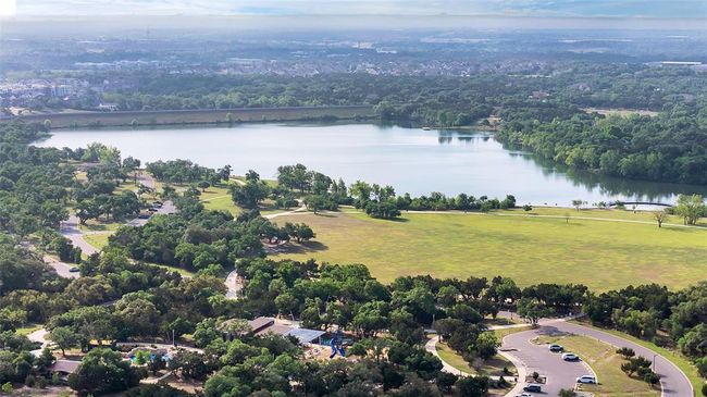 Aerial view of Lakewood Park, with access within the Crystal Springs neighborhood. Lakewood Park features a lake for fishing and kayaking, a .5 mile jogging track, a playground, bathrooms, lawns, event pavilions, splash pads, skateboarding park and much more. | Image 36