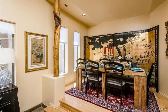 Dining room with wood finished floors and baseboards | Image 48