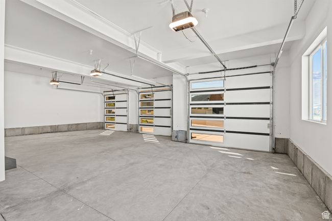 Garage with a garage door opener | Image 61