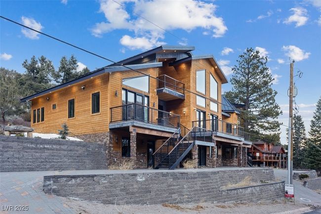 View of side of property with stone siding and stairs | Image 10