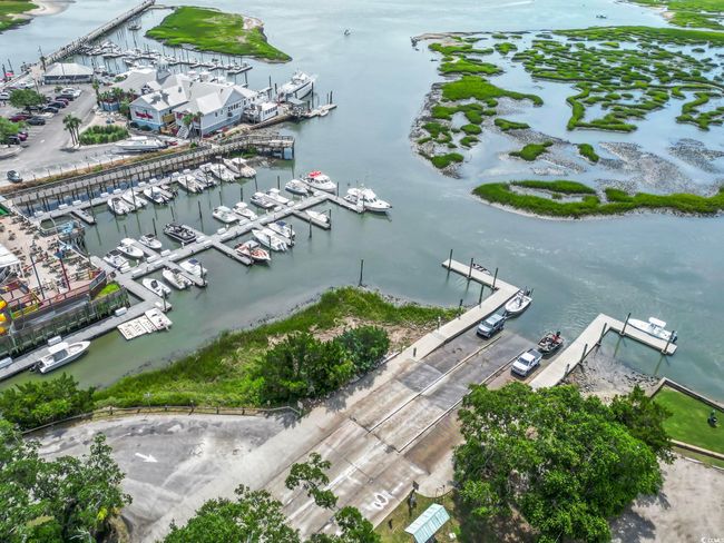 Bird's eye view of numerous boat docks and a large body of water | Image 34