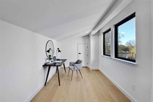 Hallway featuring light hardwood / wood-style floors and vaulted ceiling | Image 16