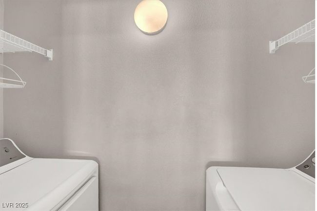 Clothes washing area featuring laundry area and separate washer and dryer | Image 13