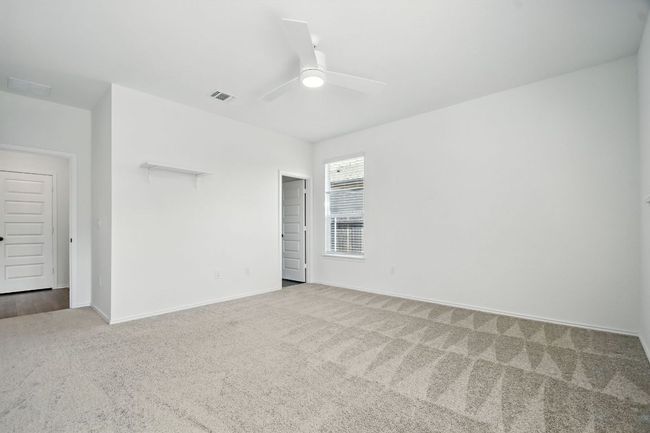 Unfurnished room with carpet and ceiling fan | Image 16