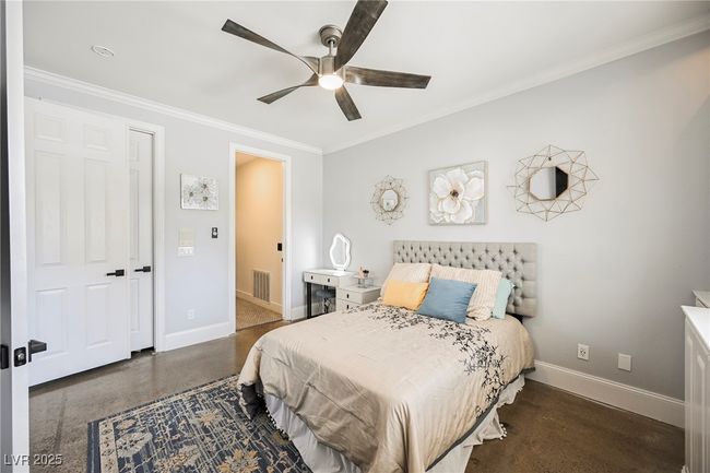 Bedroom with crown molding, baseboards, a ceiling fan, and visible vents | Image 31
