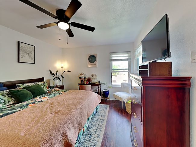 Bedroom featuring dark wood finished floors and a ceiling fan | Image 8