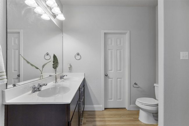 Full bath featuring double vanity and lots of storage | Image 15