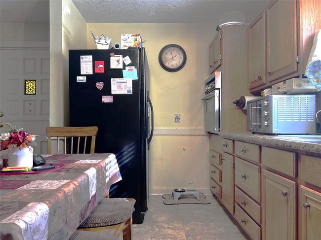 Viewing the length of the galley kitchen area. | Image 23