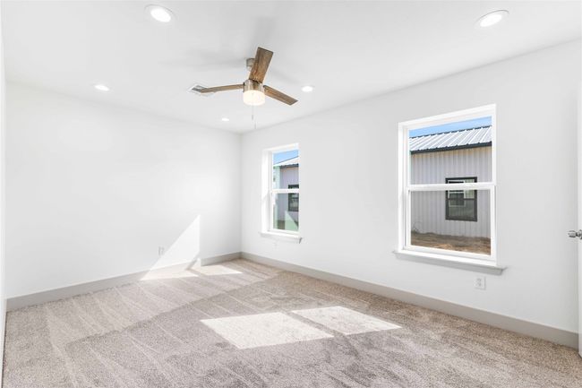 Carpeted spare room featuring recessed lighting, a ceiling fan, and baseboards | Image 16