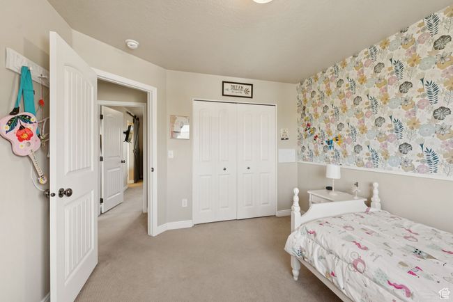 Carpeted bedroom featuring a closet and baseboards | Image 24