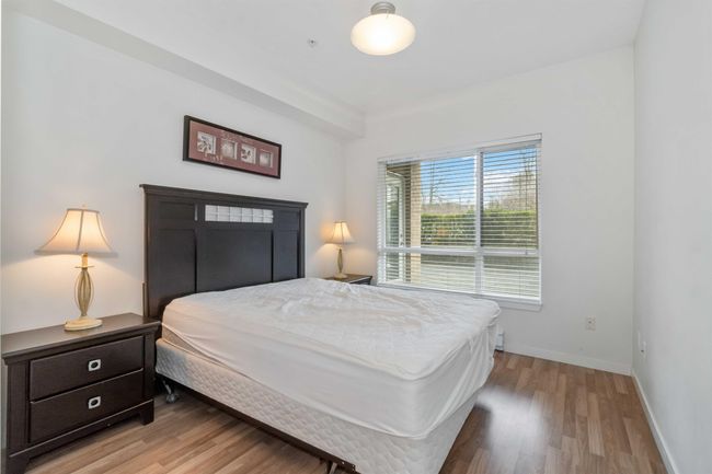 Bedroom with light wood finished floors and baseboards | Image 30
