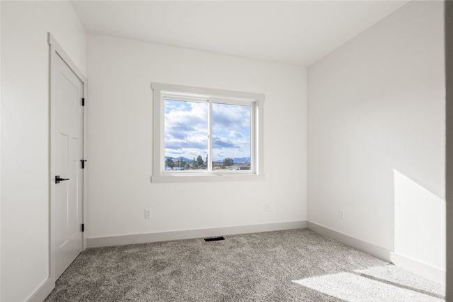 Unfurnished bedroom featuring carpet and baseboards | Image 39