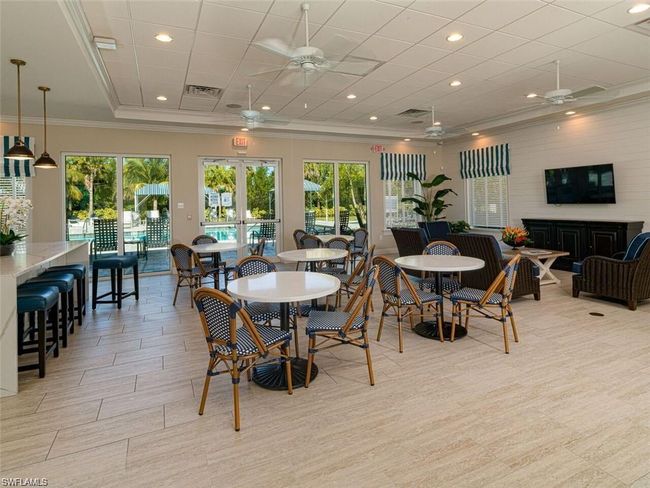 Dining area featuring ornamental molding and a healthy amount of sunlight | Image 27