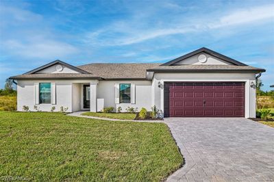 Front of house with paver driveway. | Image 1