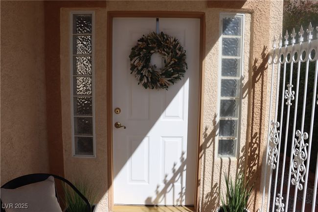 View of exterior entry featuring stucco siding | Image 11