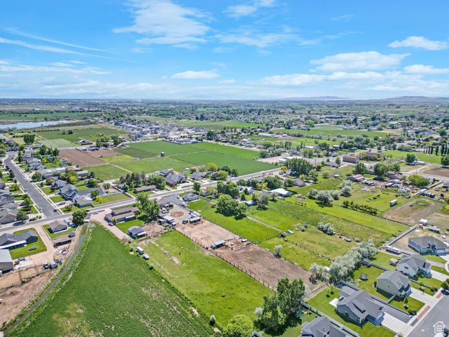 Aerial perspective of suburban area featuring a nearby body of water | Image 49