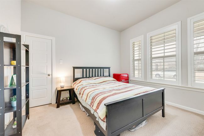 Carpeted bedroom featuring baseboards | Image 13