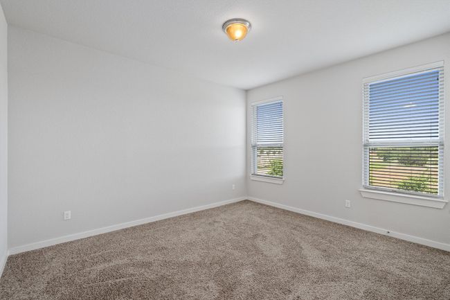 Spare room featuring carpet flooring and baseboards | Image 29