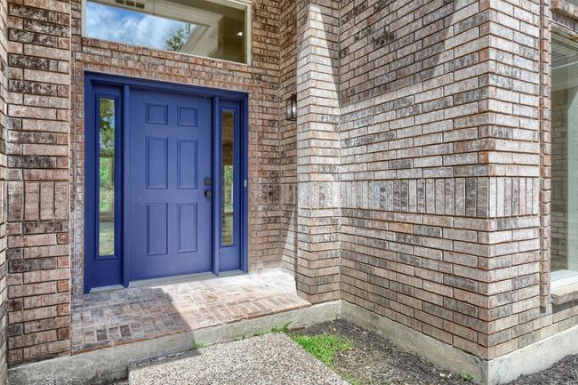 Property entrance with brick siding | Image 5