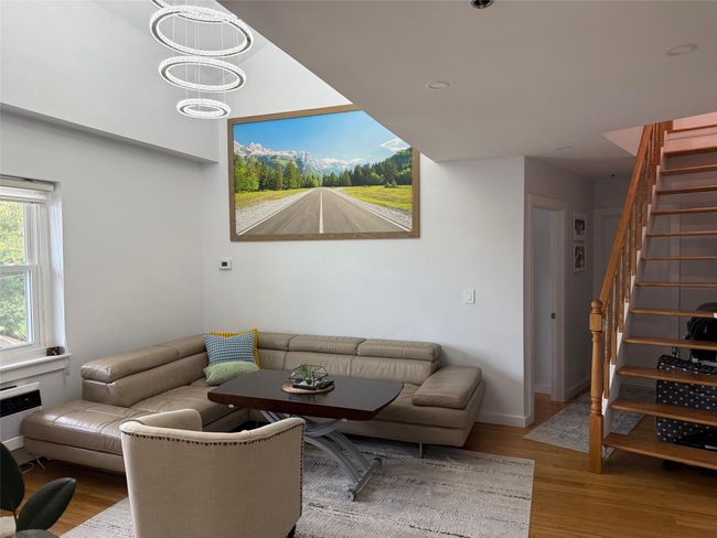 Living area with stairway and wood finished floors | Image 4