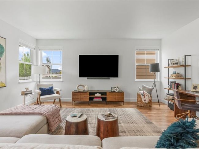Living area featuring wood finished floors and baseboards | Image 5