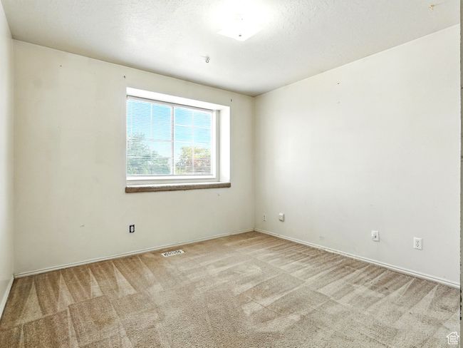 Unfurnished room featuring light carpet and baseboards | Image 20