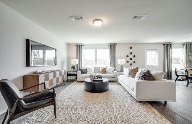 Airy gathering room showcases open concept floorplan *Model representation | Image 9