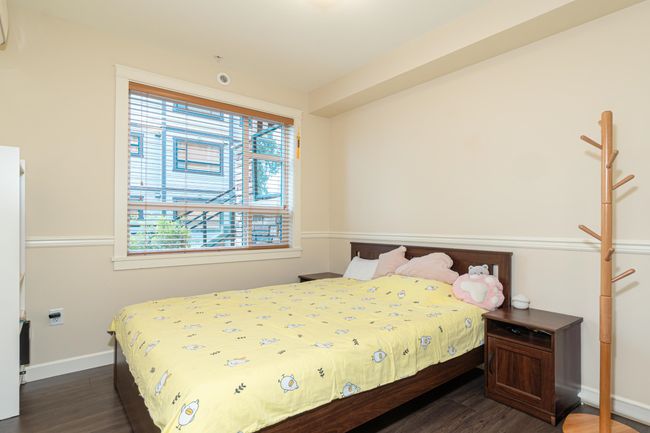 Bedroom featuring dark wood finished floors and baseboards | Image 24