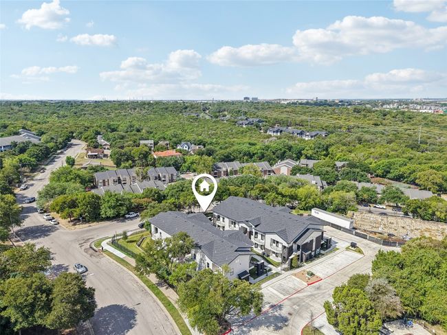 Aerial view of residential area with a heavily wooded area | Image 31