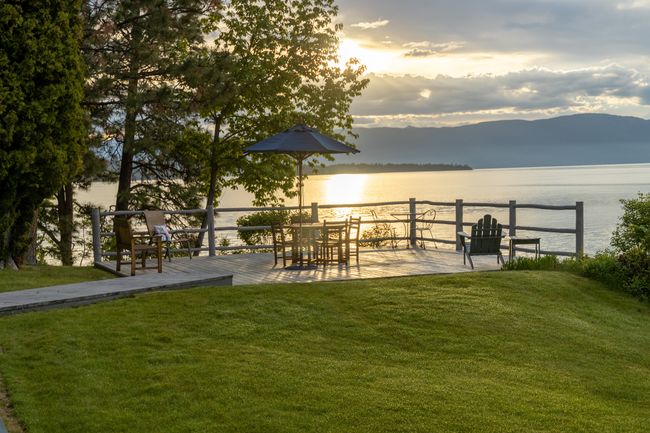 Yard at dusk featuring a water and mountain view | Image 46