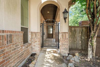 gated for additional security with an attractive walkway | Image 3