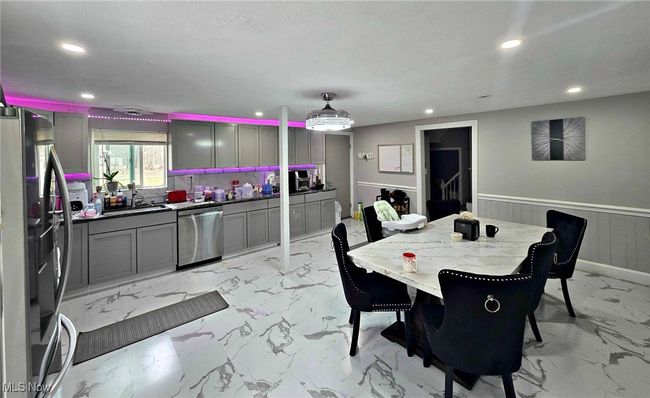 Dining area with wainscoting, recessed lighting, and marble finish floor | Image 23