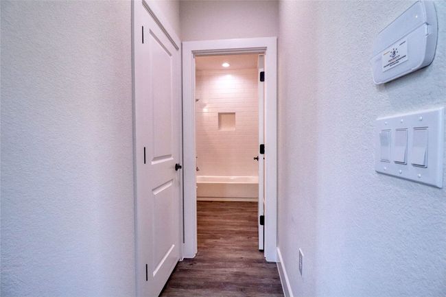 Hallway with dark hardwood / wood-style flooring | Image 16