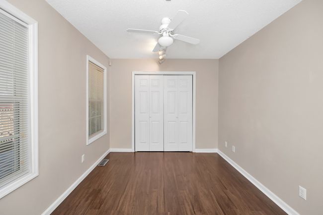 Bedroom- wood flooring, ceiling fan | Image 16