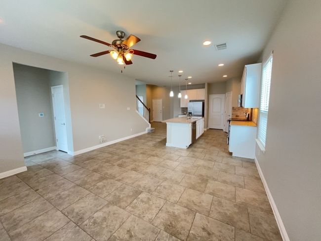 Living room and Dining area open floor plan, ceiling fan, and recessed lighting | Image 11
