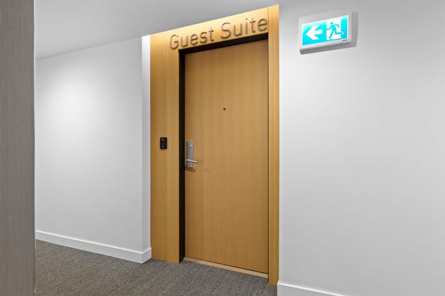 Hallway featuring carpet floors, elevator, and baseboards | Image 26