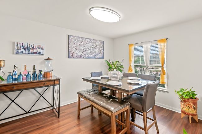 Dining room with dark hardwood / wood-style floors | Image 4