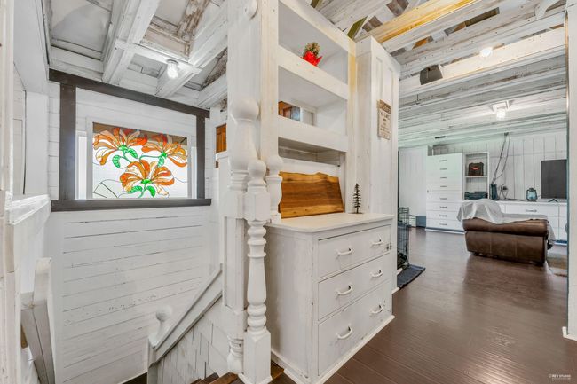 Interior space with dark wood-type flooring and beamed ceiling | Image 23