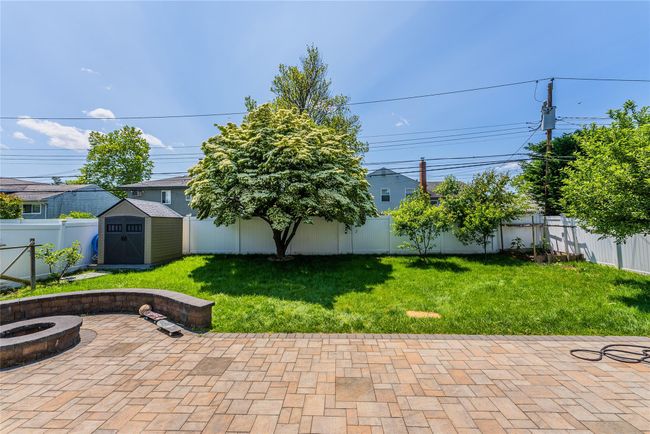 View of patio featuring an outdoor fire pit | Image 28