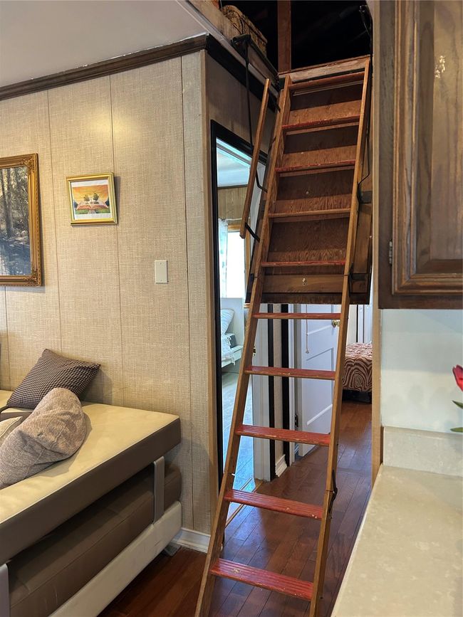 Stairway featuring hardwood / wood-style floors | Image 23