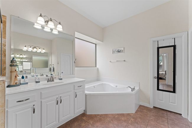 Bathroom with a bath and vanity | Image 20