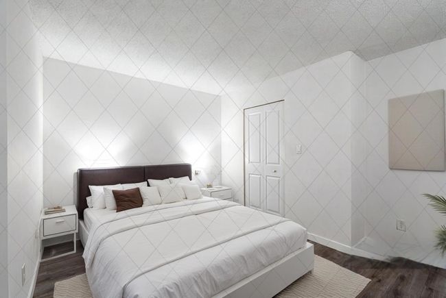 Bedroom with wood finished floors | Image 16