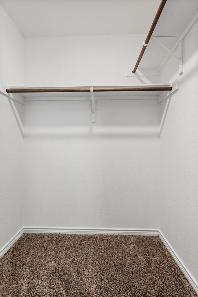 Spacious closet with carpet floors | Image 27